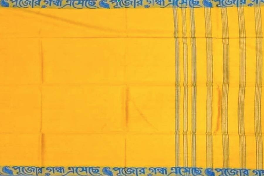 These sarees with Bengali writing on the border are being made in Shantipur, Phulia
