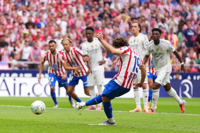 Julian Alvarez scores Atletico's third goal from the penalty spot